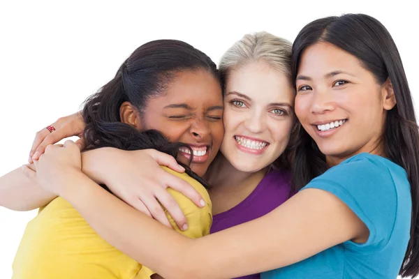 Diverse young women hugging each other Royalty Free Stock Photos