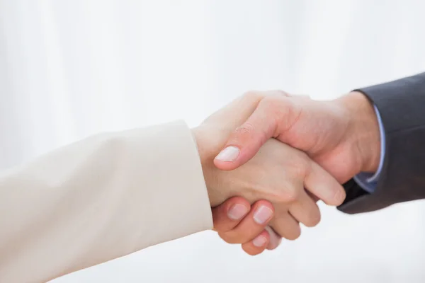 Close up on partners shaking hands — Stock Photo, Image