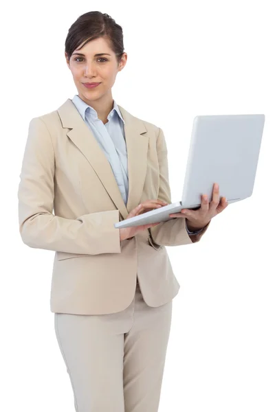 Young businesswoman holding laptop — Stock Photo, Image