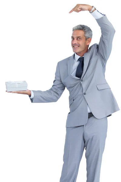 Funny businessman offering gift — Stock Photo, Image