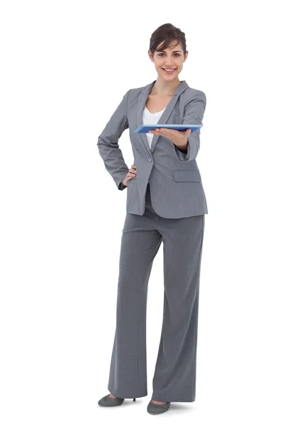 Happy businesswoman holding tablet pc — Stock Photo, Image