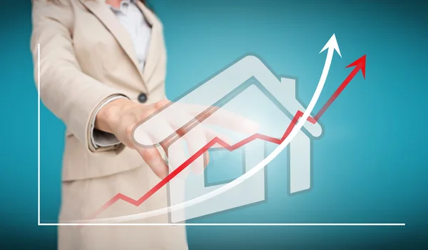 Businesswoman touching futuristic house interface with graph — Stock Photo, Image