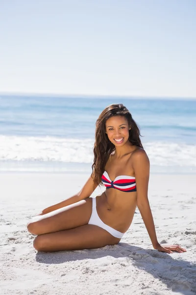 Attractive young tanned woman in bikini posing — Stock Photo, Image