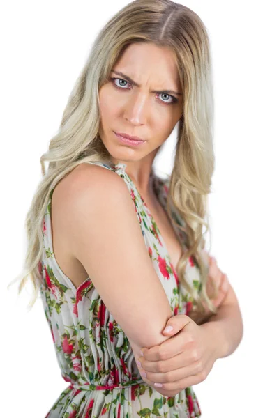 Serious seductive blonde wearing flowered dress posing — Stock Photo, Image