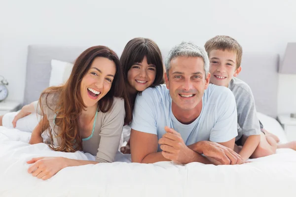 Happy family lying together — Stock Photo, Image