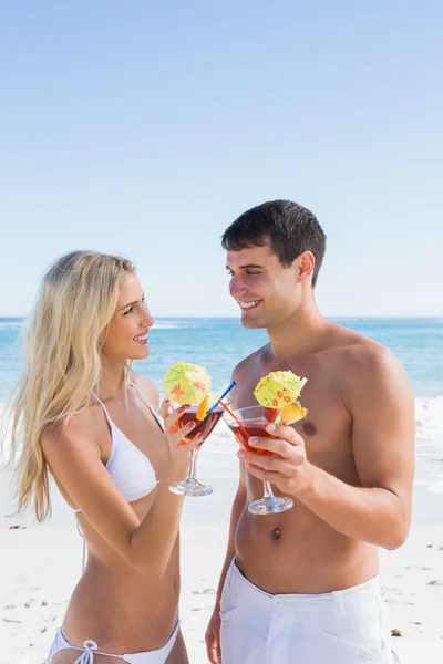 Attractive young couple holding cocktails — Stock Photo, Image