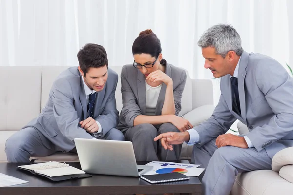 Business people using laptop and working together on sofa — Stock Photo, Image