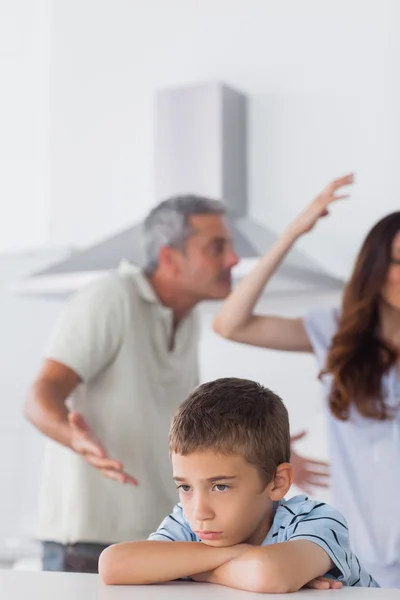 Couple having dispute in front of their upset son — Stock Photo, Image