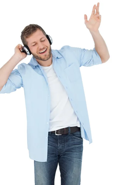 Cool trendy model listening to music and singing — Stock Photo, Image