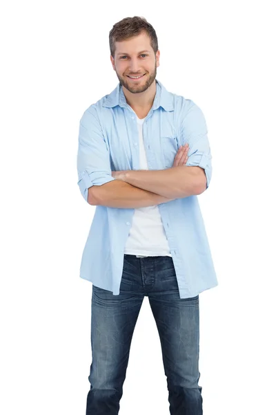 Smiling man crossing arms — Stock Photo, Image