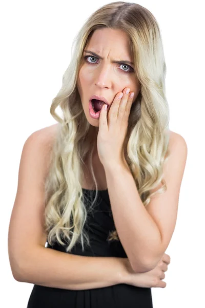 Furious gorgeous blonde in black dress posing — Stock Photo, Image