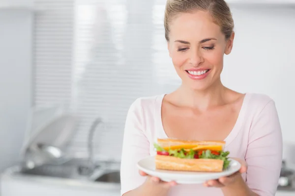 Cheerful pretty blonde with sandwich — Stock Photo, Image