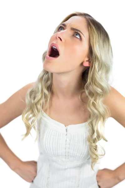 Angry sexy blonde looking up — Stock Photo, Image