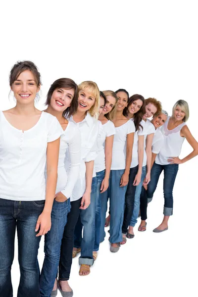 Casual models in a line looking at camera Royalty Free Stock Images