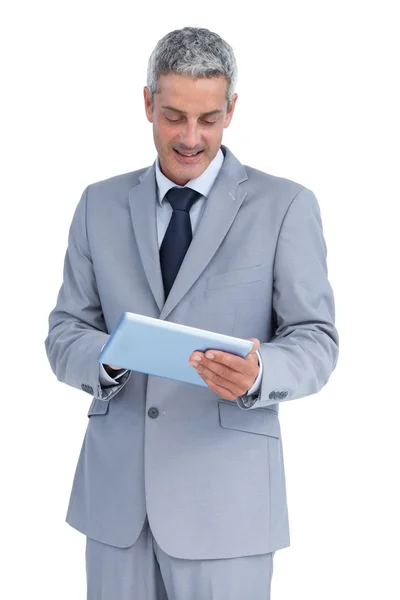 Happy businessman using tablet pc Royalty Free Stock Images