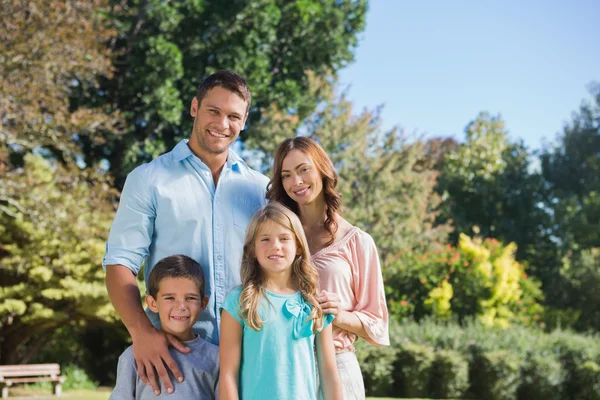 Cheerful family standing in the countryside Stock Image