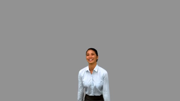 Happy businesswoman raising arms on grey screen — Stock Video