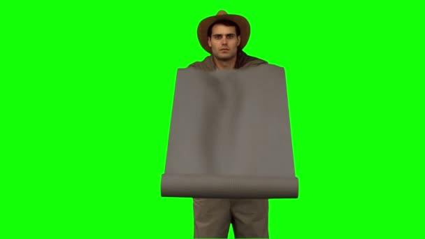 Man rolling out a sleeping bag on green screen — Stock Video