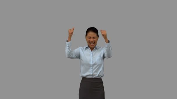 Feliz mujer de negocios haciendo gestos en pantalla gris — Vídeos de Stock