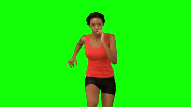 Frau joggt auf grünem Bildschirm — Stockvideo