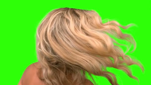 Attractive woman tossing her hair on green screen — Stock Video