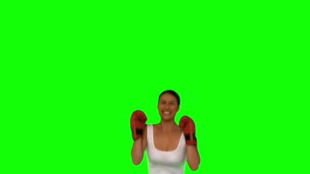 Woman wearing red gloves and jumping — Stock Video