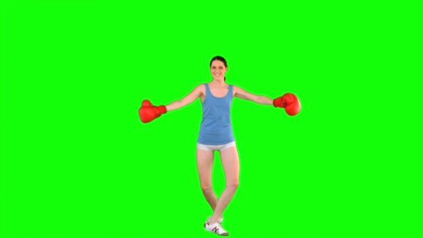 Energetic model with boxing gloves turning round — Stock Video