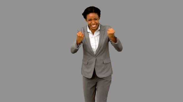 Attractive businesswoman gesturing on grey screen — Stock Video