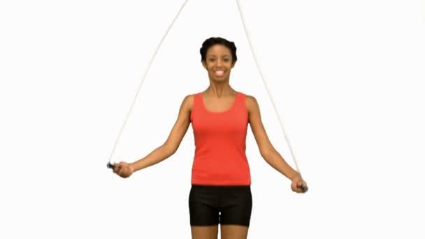 Cheerful woman working out with a rope on white screen — Stock Video