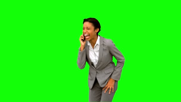 Businesswoman laughing while phoning on green screen — Stock Video