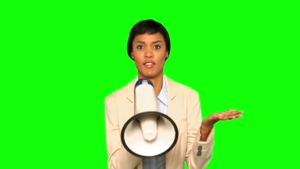 Serious businesswoman talking on megaphone — Stock Video