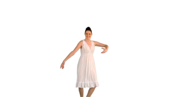 Beautiful young model in white dress jumping — Stock Video