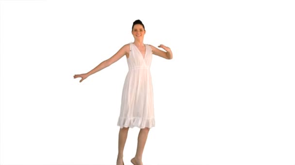 Beautiful model in white dress jumping — Stock Video