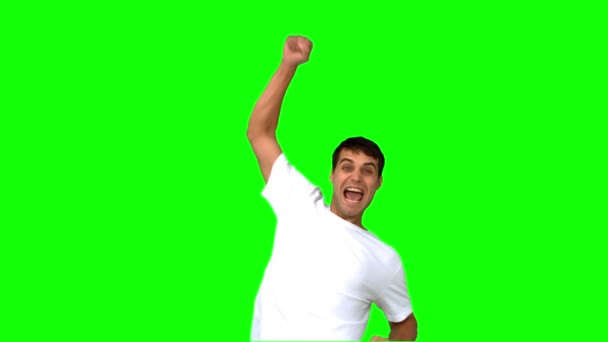 Happy man raising his arm on green screen — Stock Video