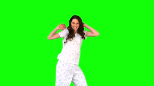 Energetic young model in pyjamas dancing — Stock Video