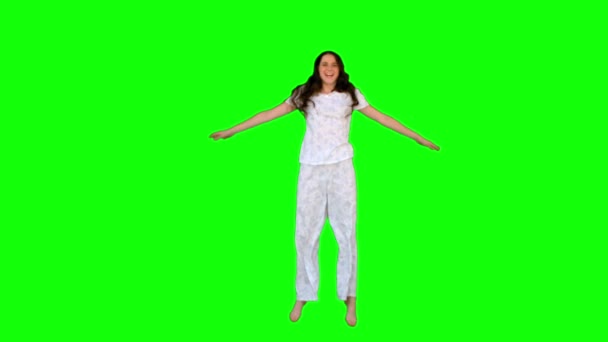 Energetic young model in pyjamas exercising — Stock Video