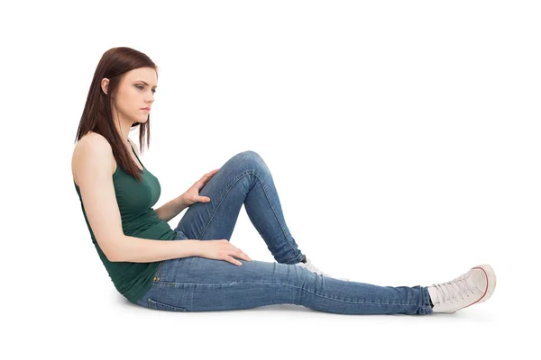 Thoughtful attractive brunette sitting — Stock Photo, Image