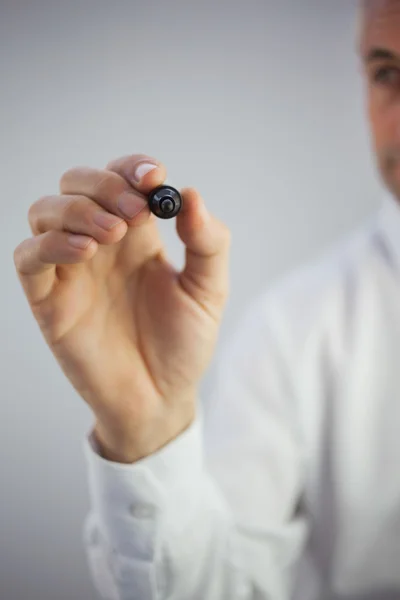 Close up of a stylish businessman holding a marker — Stock Photo, Image