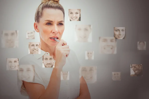 Serious businesswoman encircled by digital interface — Stock Photo, Image