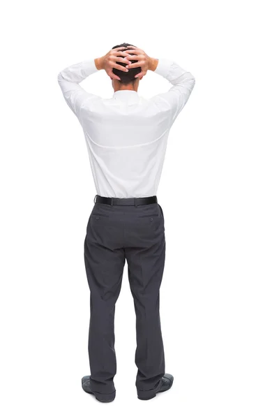Businessman standing back to camera hands on head — Stock Photo, Image