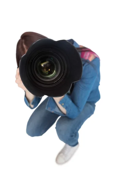 High angle view of young photographer taking picture of camera — Stock Photo, Image