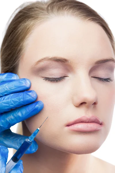 Content cute model having botox injection on the cheek — Stock Photo, Image