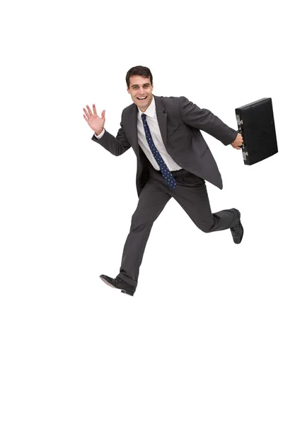 Feliz hombre de negocios sosteniendo un maletín y corriendo —  Fotos de Stock