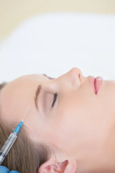 Surgeon making injection on peaceful woman lying — Stock Photo, Image