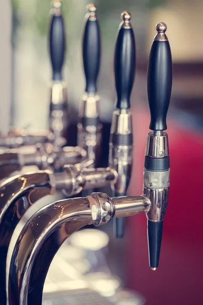 Silver and black beer taps close up — Stock Photo, Image