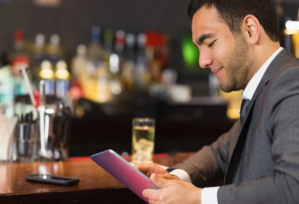 Close up of businessman sitting at bar — Stock Photo, Image