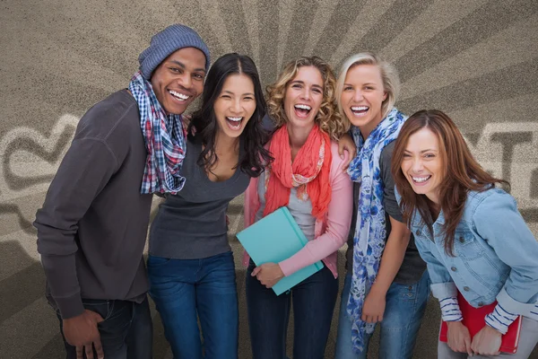 Fashionable students in a row smiling — Stock Photo, Image