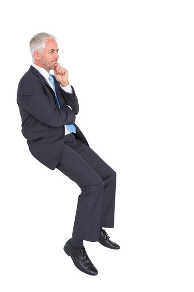 Businessman looking up while thinking — Stock Photo, Image