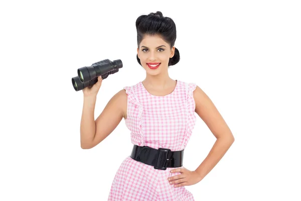 Delighted black hair model holding binoculars — Stock Photo, Image