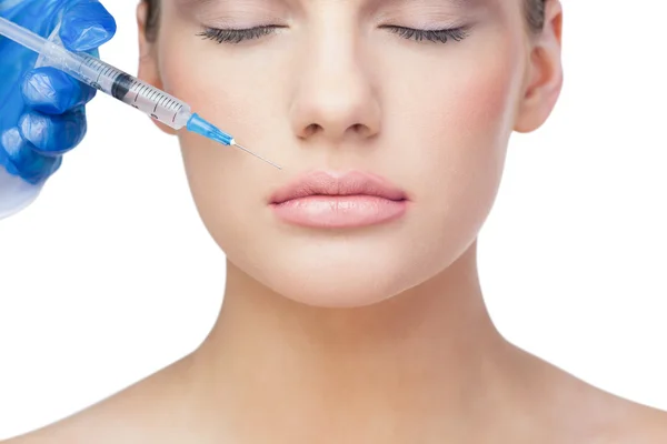 Relaxed beautiful blonde having injection above the lips — Stock Photo, Image